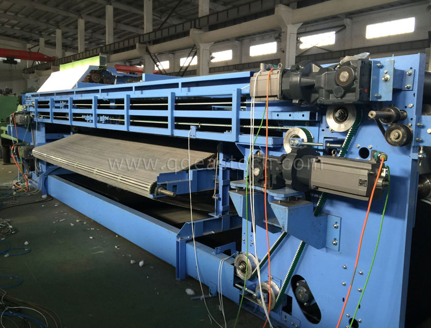 High speed web-laying machine